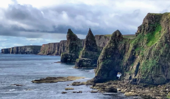 The rugged coastal views you get to see when cycling in the Scottish Highlands.