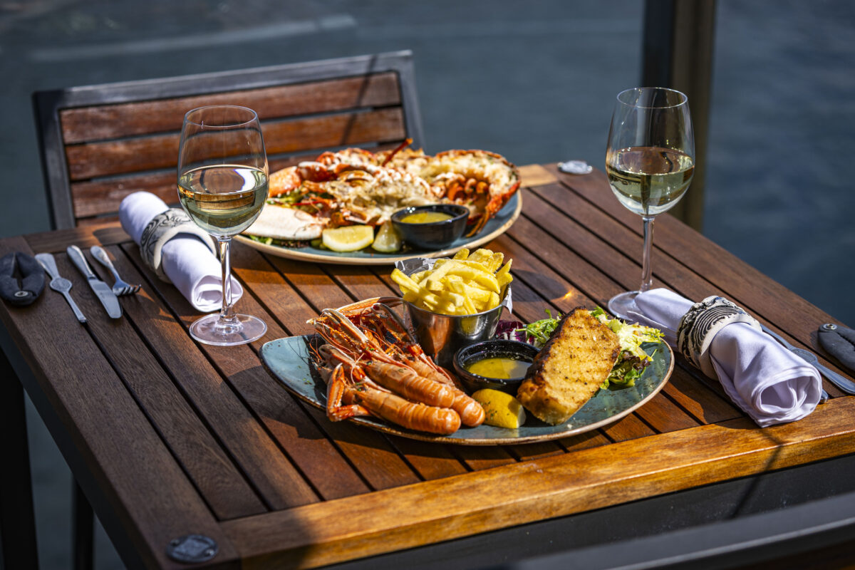 Fresh seafood meal served outdoors at Kylesku Hotel overlooking the water on the North Coast 500